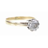 A diamond single stone ring The round brilliant-cut diamond, claw set, to a yellow metal shank,