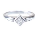 A diamond single stone ring The princess-cut bezel set diamond,