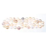 A freshwater pearl necklace The uniform freshwater pearls, varying in colour,