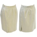 Burberrys: Two ladies pencil skirts Of the same design, one in ochre, the other in a moss green,
