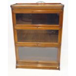 An early 20th Century glazed mahogany three tier stacking bookcase The rectangular top with low