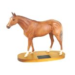A Beswick model of a horse 'Grundy', raised on oval wooden plinth base,
