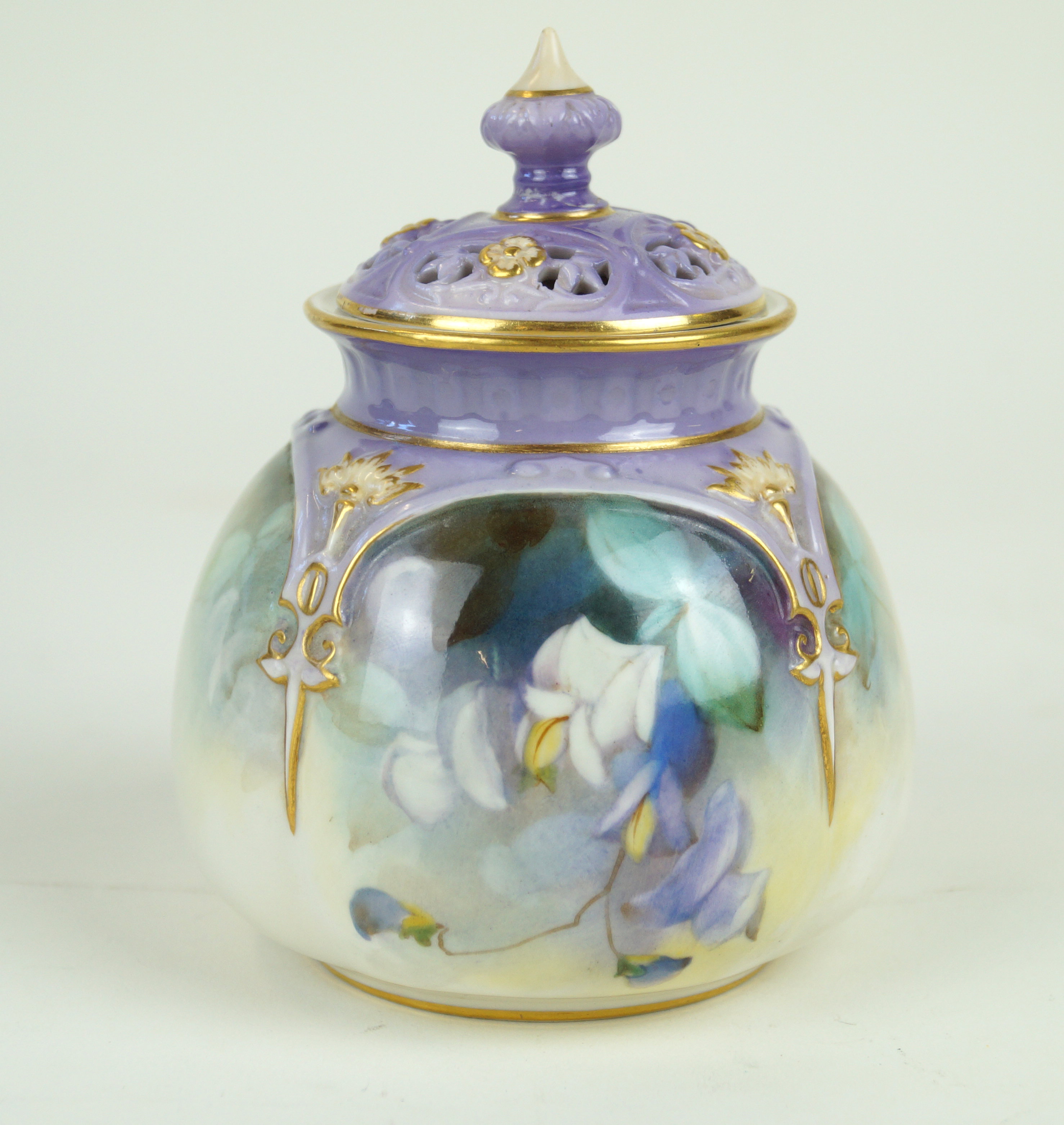 A Royal Worcester hand-painted pot pourri and cover Decorated with floral sprays with gilt and