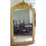 A large and ornate Victorian gilt gesso finished mirror of country house proportions Featuring a