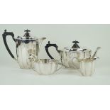 A contemporary hallmarked silver four piece tea service Comprising teapot, water pot,