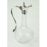 A late 19th/early 20th Century cut glass claret jug With silver-plated mount and handle,