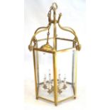 A large and ornate Georgian style glazed brass hexagonal hanging lantern,
