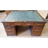 An early 20th Century kneehole partners pedestal desk The large rectangular top inset with a gilt