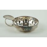 A continental white metal wine taster Having cast and embossed decoration, impressed marks to rim,