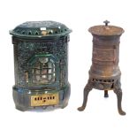 A French enamelled cast iron wood burning stove Decorated in relief and pierced with stylised