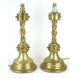 A pair of Gothic style brass table lamps Each having double ringed relief decoration with twisted
