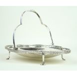 A George VI hallmarked silver swing handled basket Having planished decorated bowl,