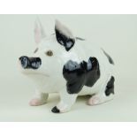 A large Wemyss Ware pig modelled seated Painted in shades of black, pink and white,