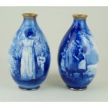 A pair of Royal Doulton vases of ovoid form Depicting scenes of a Victorian woman and children in