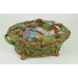 A 19th Century Majolica possibly Mintons game pie dish and cover The cover decorated in relief with
