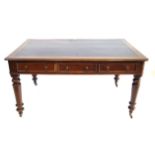 A Victorian oak partners writing table The rectangular top with rounded corners and moulded edges