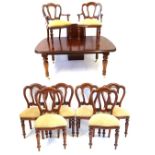 A Victorian style mahogany extending dining table with one extra leaf and eight chairs,