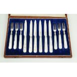 A cased George VI hallmarked silver and mother of pearl fruit set Comprising six forks and six