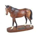 A Beswick model of a horse 'Troy' raised on oval wooden plinth base,