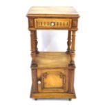 A French period style oak bedside cabinet Having a carved single frieze drawer above an open