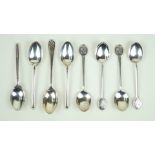A harlequin set of four hallmarked silver tennis teaspoons Each with circular ends,