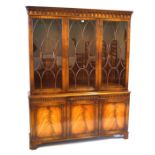 A good quality Georgian style feathered mahogany panelled tall bookcase,