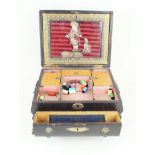 A 19th Century stained wood and leather sewing box The hinged cover lifts to enclose a silk picture