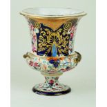 A 19th Century Derby pedestal urn vase Having Imari decoration with gilt highlights,