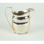 A Georgian hallmarked silver cream jug Of oval form,