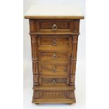 A French period style fruitwood bedside chest The marble top above a carved panel frieze drawer