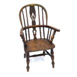 A 19th Century child's elm and beech Windsor fireside chair The comb back above dished seat,