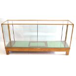 A vintage glazed light oak shop counter The traditional rectangular form,