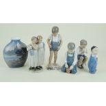 Five Royal Copenhagen and Bing & Grondahl figurines To include 'Boy with Crab', 'Boy with bucket',