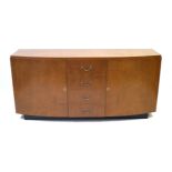 An Art Deco lacewood break front sideboard Having four drawers flanked by two cupboard doors,