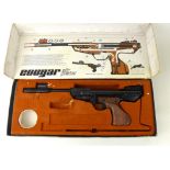 * A boxed Milbro Cougar .22 calibre air pistol 26.5cm barrel (including shroud), synthetic grip.