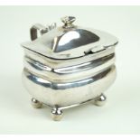 A George III hallmarked silver lidded mustard Of plain rectangular form, raised on four ball feet,