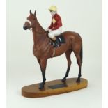 A Beswick horse 'Red Rum Brian Fletcher up' Raised on oval wooden plinth base,