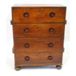 A Victorian brass bound teak two section military campaign chest Each section fitted with two long