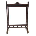 A good quality Victorian walnut fire screen in the Aesthetic taste,