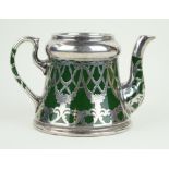 A continental ceramic teapot with white metal mounts Decorated with bows and floral motifs,
