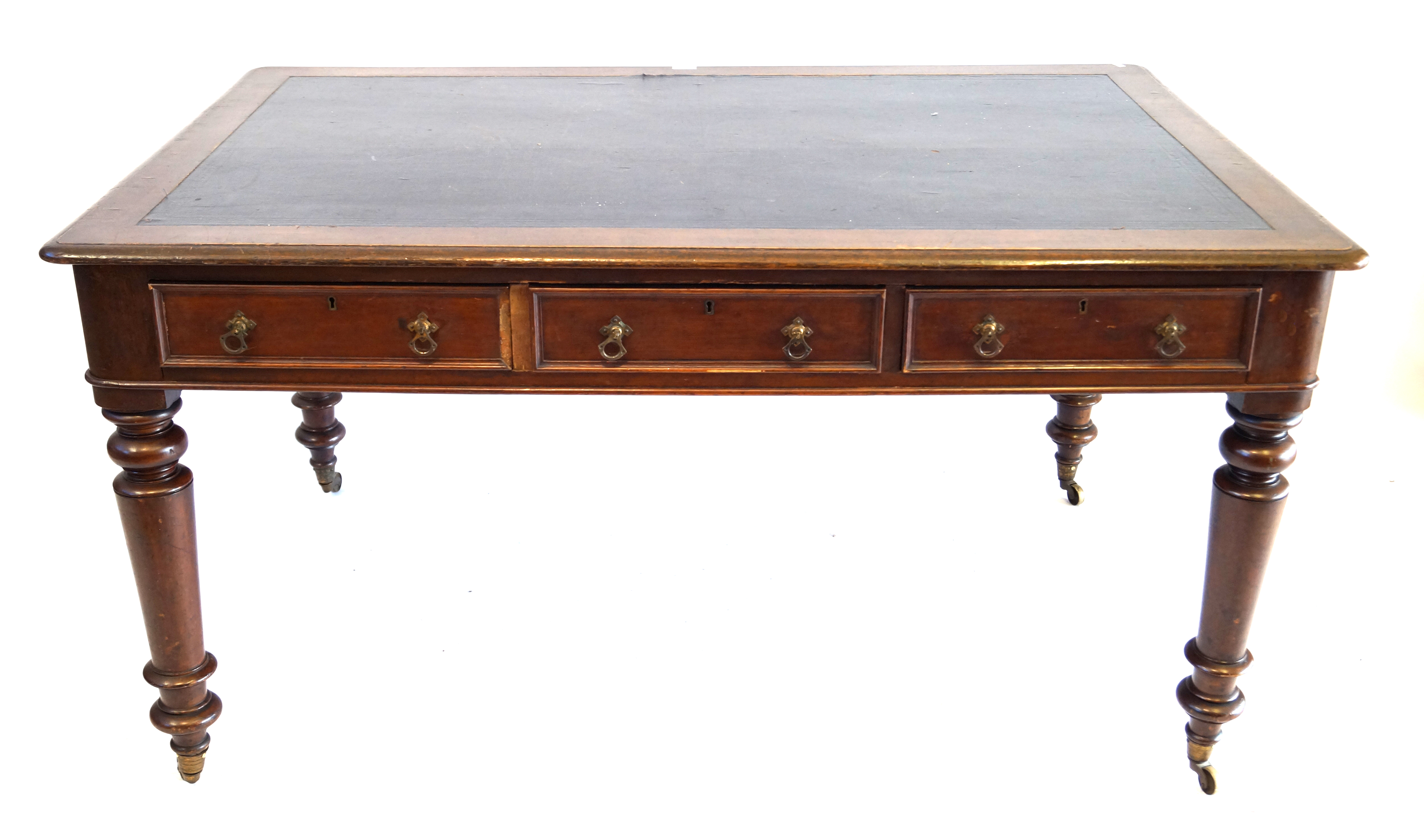 A Victorian oak partners writing table The rectangular top with rounded corners and moulded edges