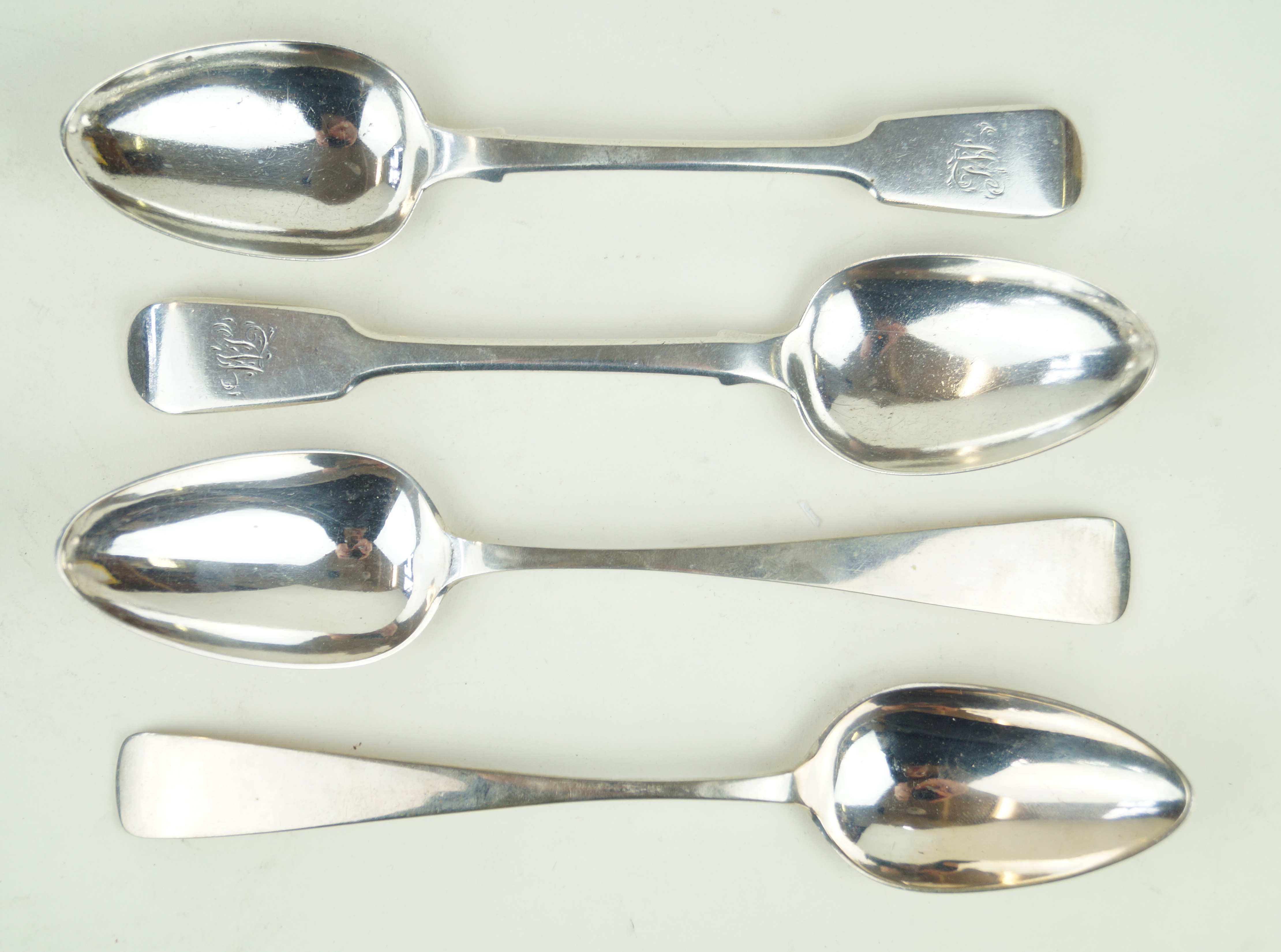 A pair of Victorian hallmarked silver tablespoons Each of plain form with engraved initials to