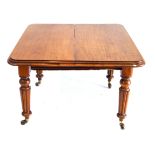 A Victorian mahogany extending dining table The rectangular top with rounded corners and moulded