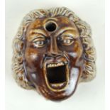 A salt glazed Bellowing Man inkwell 19th Century,