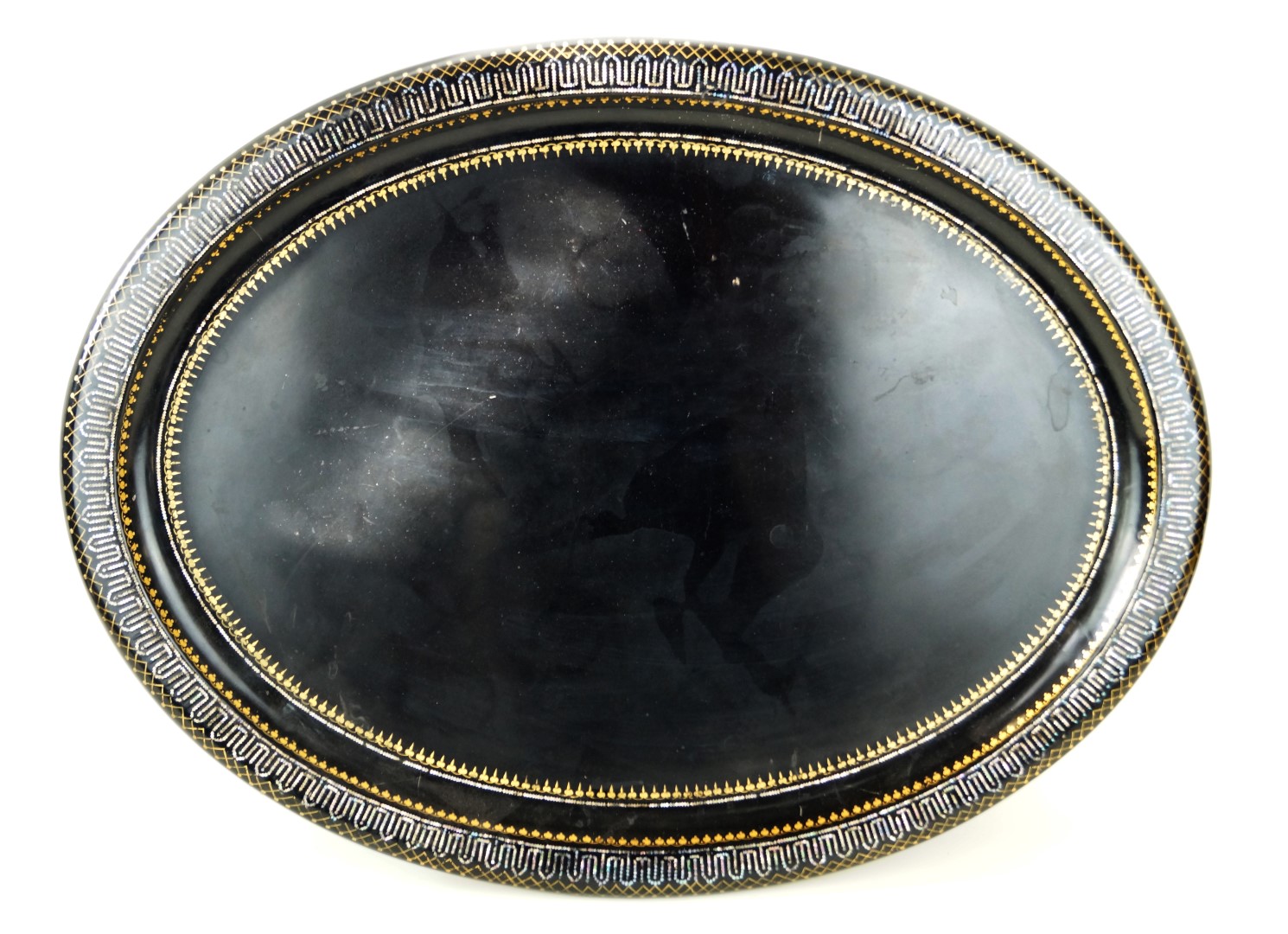 A Victorian papier mache Toleware tray Having mother of pearl inlaid decoration with gilt