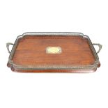 A 1920's oak and silver-plated twin handled butlers tray Having pierced gallery,