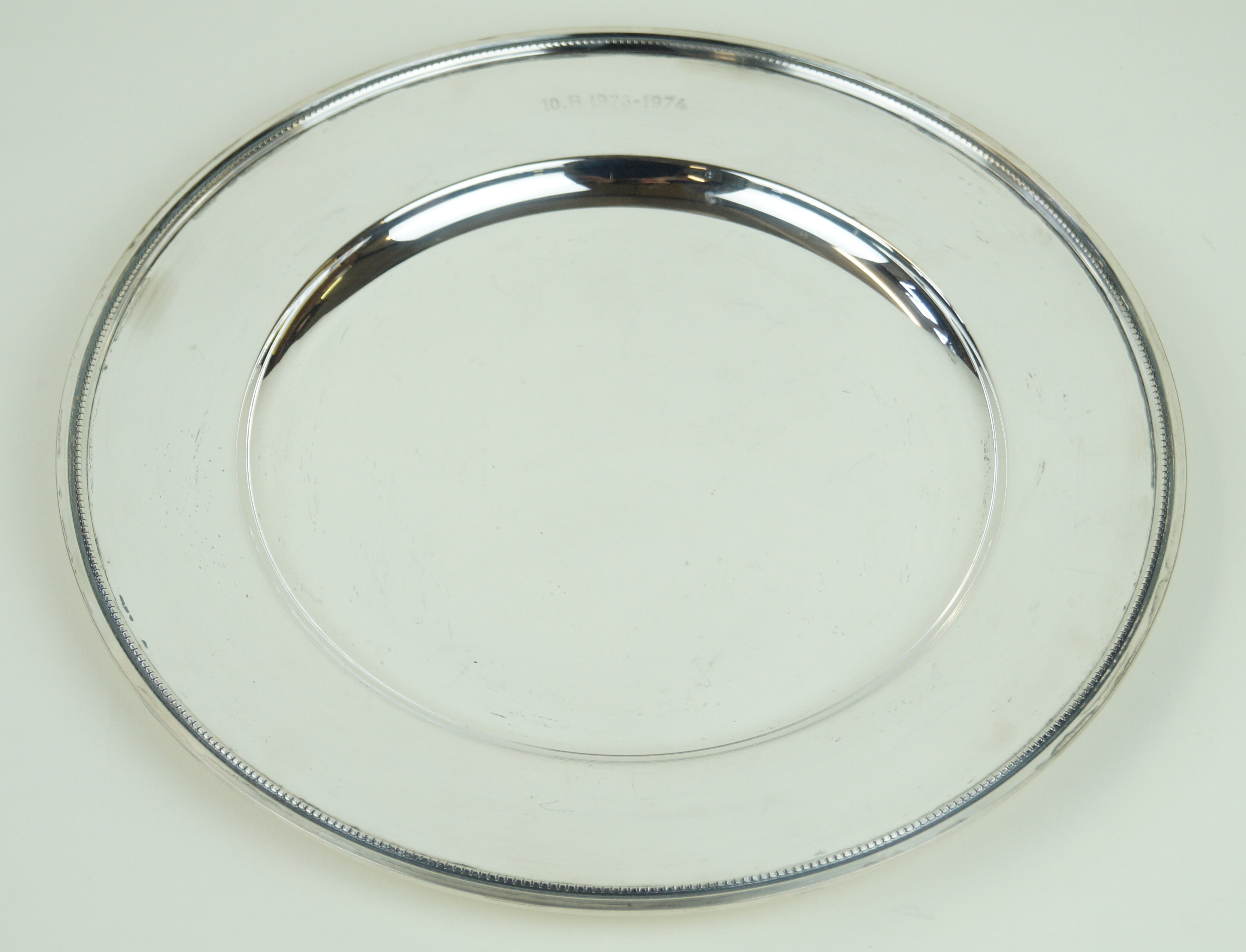 A Danish white metal circular plate Having cast beaded rim, by Solvplet HJ Denmark,