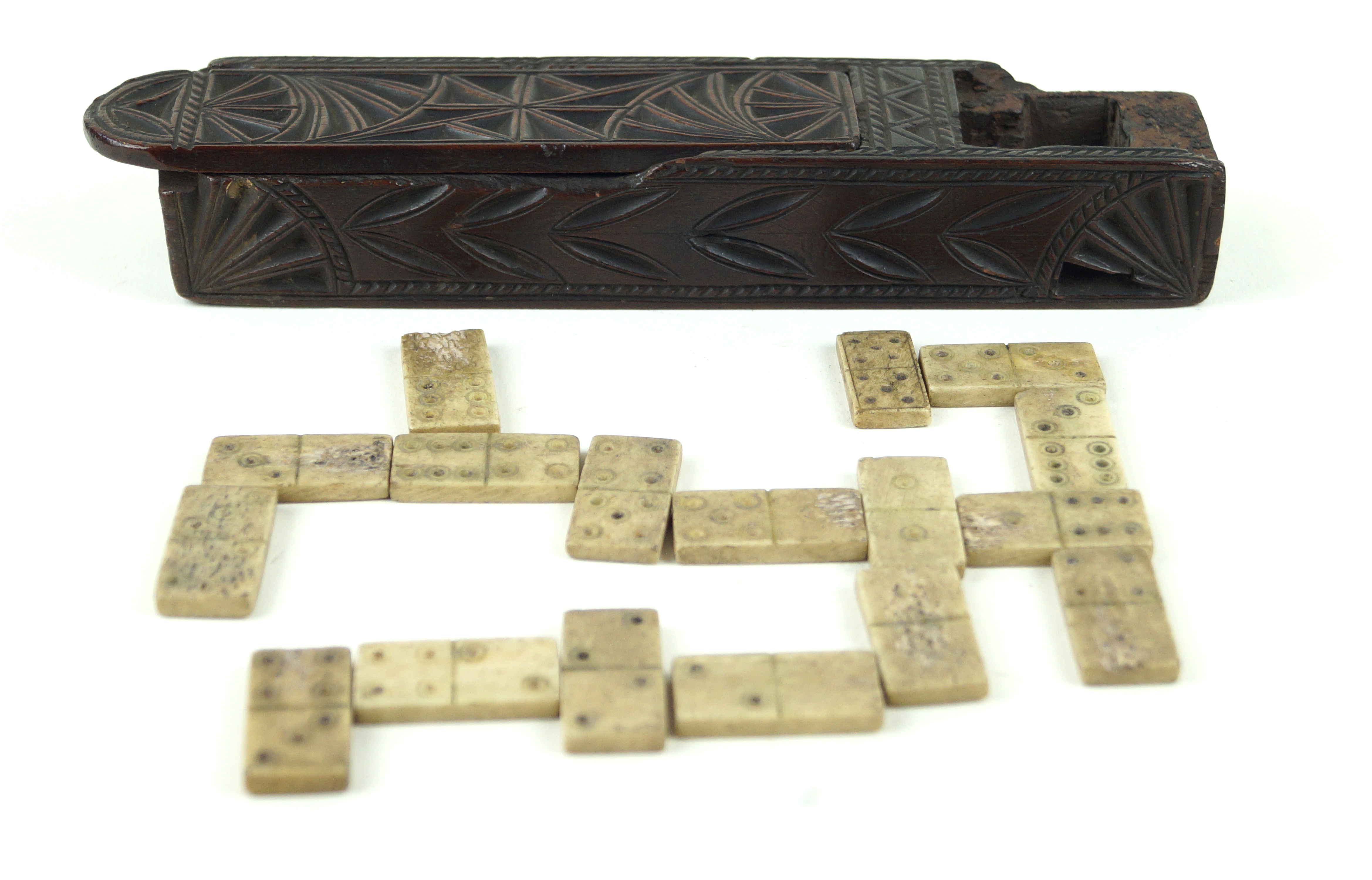 An interesting 18th/19th Century carved wooden gaming box Having carved geometric and floral