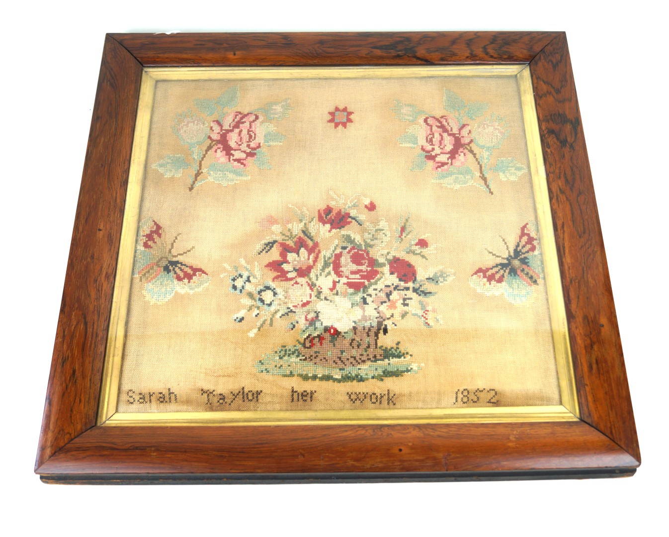 A 19th Century silk work tapestry panel Decorated with roses and a central basket of flowers by