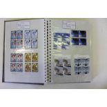 Three albums of GB mint stamps from 1998 - 2003 Comprising mainly blocks of four.